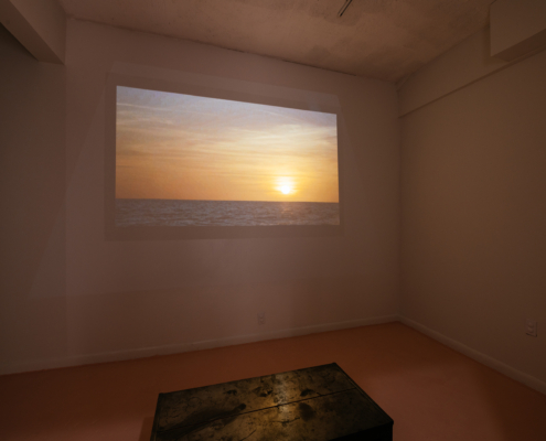Video of Sunset on wall with a cube