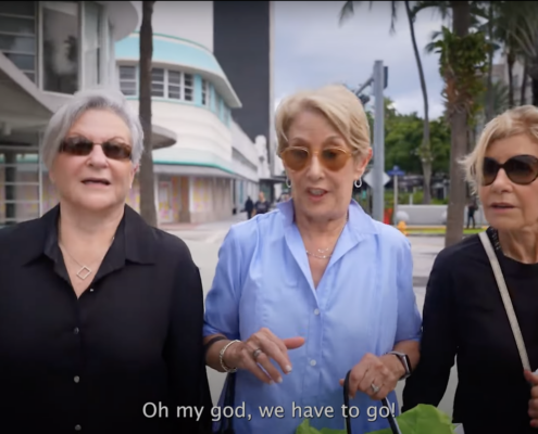 Three older women with shopping bags
