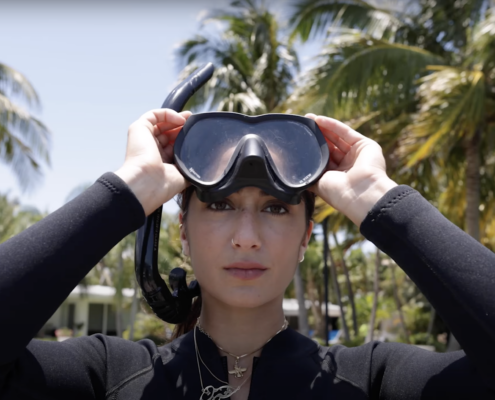Close up of a woman with goggles on her head