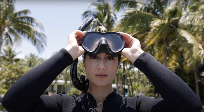 Close up of a woman with goggles on her head